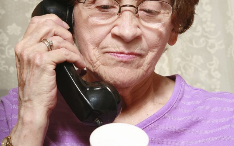 Old lady consumer on phone